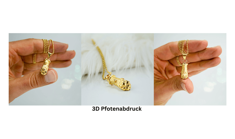 Hand hält eine goldene Halskette mit einem Anhänger in Form einer Pfote aus Metall, vor hellem Hintergrund